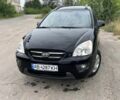 Черный Киа Каренс, объемом двигателя 2 л и пробегом 225 тыс. км за 5650 $, фото 1 на Automoto.ua