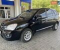 Черный Киа Каренс, объемом двигателя 2 л и пробегом 304 тыс. км за 7400 $, фото 1 на Automoto.ua