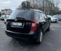 Черный Киа Каренс, объемом двигателя 2 л и пробегом 250 тыс. км за 5600 $, фото 4 на Automoto.ua