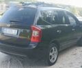 Чорний Кіа Каренс, об'ємом двигуна 2 л та пробігом 265 тис. км за 5800 $, фото 2 на Automoto.ua