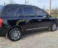Черный Киа Каренс, объемом двигателя 2 л и пробегом 229 тыс. км за 5200 $, фото 1 на Automoto.ua