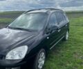 Чорний Кіа Каренс, об'ємом двигуна 2 л та пробігом 296 тис. км за 6400 $, фото 1 на Automoto.ua