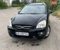 Черный Киа Каренс, объемом двигателя 2 л и пробегом 230 тыс. км за 5700 $, фото 1 на Automoto.ua