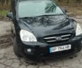 Черный Киа Каренс, объемом двигателя 2 л и пробегом 265 тыс. км за 5900 $, фото 1 на Automoto.ua