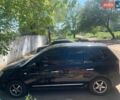 Черный Киа Каренс, объемом двигателя 2 л и пробегом 213 тыс. км за 5488 $, фото 1 на Automoto.ua