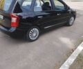 Чорний Кіа Каренс, об'ємом двигуна 2 л та пробігом 185 тис. км за 6000 $, фото 1 на Automoto.ua