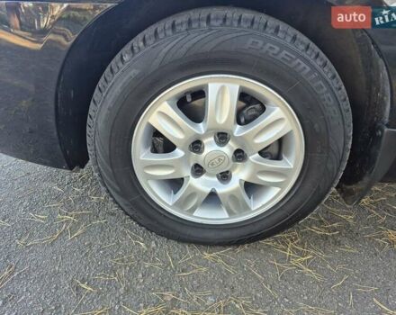 Чорний Кіа Каренс, об'ємом двигуна 2 л та пробігом 88 тис. км за 6450 $, фото 44 на Automoto.ua