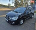 Чорний Кіа Каренс, об'ємом двигуна 2 л та пробігом 88 тис. км за 6450 $, фото 9 на Automoto.ua