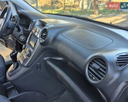 Чорний Кіа Каренс, об'ємом двигуна 2 л та пробігом 88 тис. км за 6450 $, фото 37 на Automoto.ua