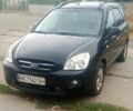 Чорний Кіа Каренс, об'ємом двигуна 2 л та пробігом 223 тис. км за 8300 $, фото 1 на Automoto.ua