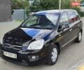 Чорний Кіа Каренс, об'ємом двигуна 2 л та пробігом 191 тис. км за 6500 $, фото 1 на Automoto.ua