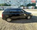 Черный Киа Каренс, объемом двигателя 2 л и пробегом 210 тыс. км за 6500 $, фото 1 на Automoto.ua