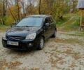 Чорний Кіа Каренс, об'ємом двигуна 2 л та пробігом 251 тис. км за 4650 $, фото 1 на Automoto.ua