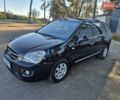 Чорний Кіа Каренс, об'ємом двигуна 2 л та пробігом 88 тис. км за 6450 $, фото 26 на Automoto.ua