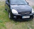 Черный Киа Каренс, объемом двигателя 2 л и пробегом 303 тыс. км за 5500 $, фото 1 на Automoto.ua