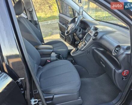 Чорний Кіа Каренс, об'ємом двигуна 2 л та пробігом 88 тис. км за 6450 $, фото 40 на Automoto.ua
