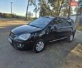 Чорний Кіа Каренс, об'ємом двигуна 2 л та пробігом 88 тис. км за 6450 $, фото 25 на Automoto.ua