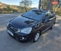 Чорний Кіа Каренс, об'ємом двигуна 2 л та пробігом 88 тис. км за 6450 $, фото 2 на Automoto.ua