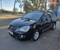 Чорний Кіа Каренс, об'ємом двигуна 2 л та пробігом 88 тис. км за 6450 $, фото 7 на Automoto.ua