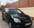 Черный Киа Каренс, объемом двигателя 2 л и пробегом 309 тыс. км за 6000 $, фото 1 на Automoto.ua