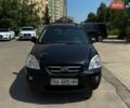 Черный Киа Каренс, объемом двигателя 2 л и пробегом 215 тыс. км за 5000 $, фото 1 на Automoto.ua