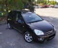 Чорний Кіа Каренс, об'ємом двигуна 2 л та пробігом 168 тис. км за 9300 $, фото 1 на Automoto.ua