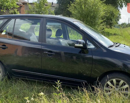 Чорний Кіа Каренс, об'ємом двигуна 2 л та пробігом 674 тис. км за 10000 $, фото 7 на Automoto.ua