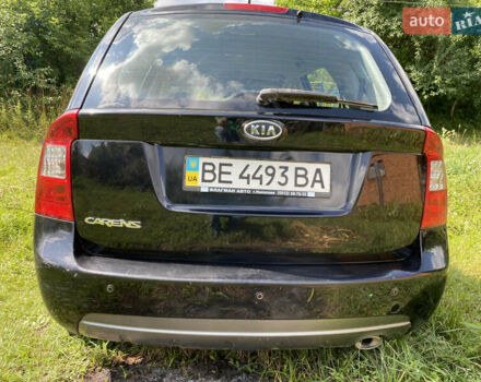 Чорний Кіа Каренс, об'ємом двигуна 2 л та пробігом 674 тис. км за 10000 $, фото 4 на Automoto.ua
