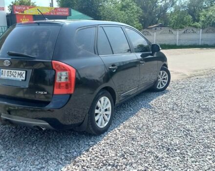 Черный Киа Каренс, объемом двигателя 2 л и пробегом 240 тыс. км за 6750 $, фото 1 на Automoto.ua