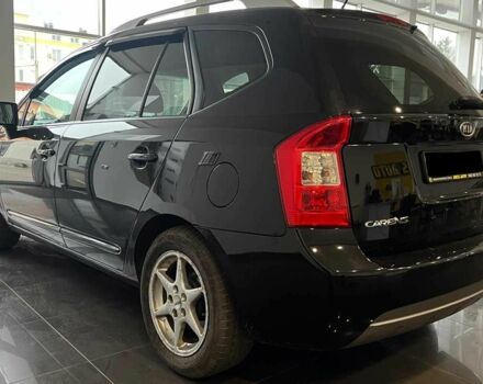 Черный Киа Каренс, объемом двигателя 1.6 л и пробегом 269 тыс. км за 7500 $, фото 4 на Automoto.ua