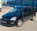 Чорний Кіа Каренс, об'ємом двигуна 2 л та пробігом 334 тис. км за 3109 $, фото 1 на Automoto.ua