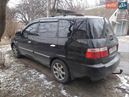 Кіа Каренс 2003 у Вышгороде на Automoto.ua Чорний Кіа Каренс, об'ємом двигуна 1.79 л та пробігом 240 тис. км за 4000 $, фото 1 на Automoto.ua