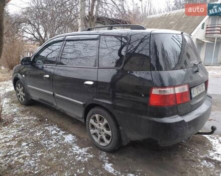 Черный Киа Каренс, объемом двигателя 1.79 л и пробегом 240 тыс. км за 4000 $, фото 1 на Automoto.ua