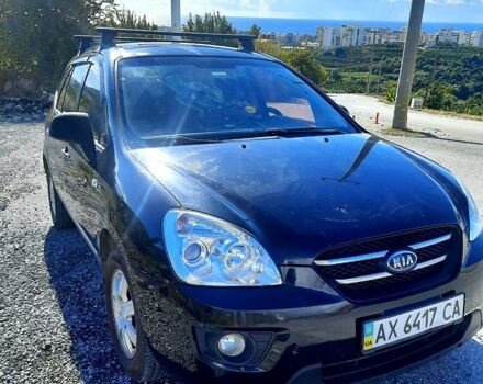 Чорний Кіа Каренс, об'ємом двигуна 2 л та пробігом 293 тис. км за 6900 $, фото 1 на Automoto.ua