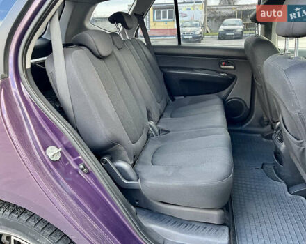 Фиолетовый Киа Каренс, объемом двигателя 2 л и пробегом 180 тыс. км за 6400 $, фото 16 на Automoto.ua