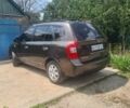 Коричневий Кіа Каренс, об'ємом двигуна 2 л та пробігом 183 тис. км за 7100 $, фото 1 на Automoto.ua
