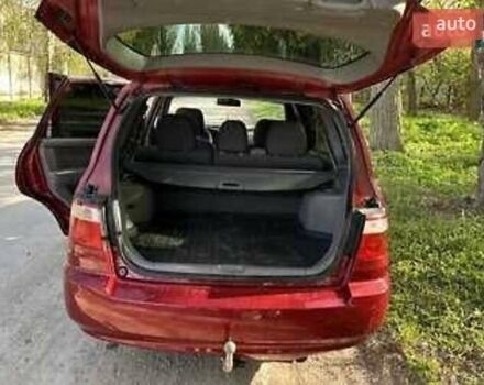 Красный Киа Каренс, объемом двигателя 2 л и пробегом 319 тыс. км за 4500 $, фото 1 на Automoto.ua