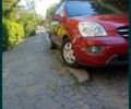 Червоний Кіа Каренс, об'ємом двигуна 2 л та пробігом 175 тис. км за 6000 $, фото 10 на Automoto.ua