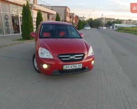 Червоний Кіа Каренс, об'ємом двигуна 2 л та пробігом 175 тис. км за 6000 $, фото 1 на Automoto.ua