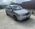 Сірий Кіа Каренс, об'ємом двигуна 2 л та пробігом 300 тис. км за 4400 $, фото 1 на Automoto.ua