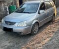 Серый Киа Каренс, объемом двигателя 2 л и пробегом 2 тыс. км за 2282 $, фото 1 на Automoto.ua