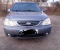 Сірий Кіа Каренс, об'ємом двигуна 2 л та пробігом 270 тис. км за 4200 $, фото 1 на Automoto.ua