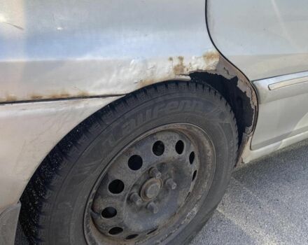 Серый Киа Каренс, объемом двигателя 2 л и пробегом 250 тыс. км за 834 $, фото 7 на Automoto.ua