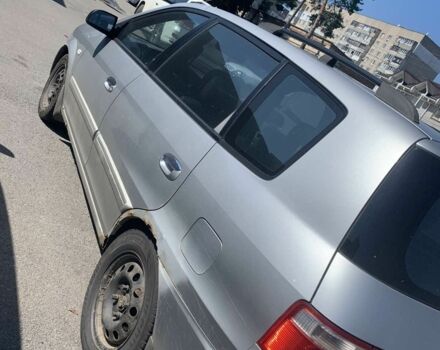 Серый Киа Каренс, объемом двигателя 2 л и пробегом 250 тыс. км за 834 $, фото 1 на Automoto.ua