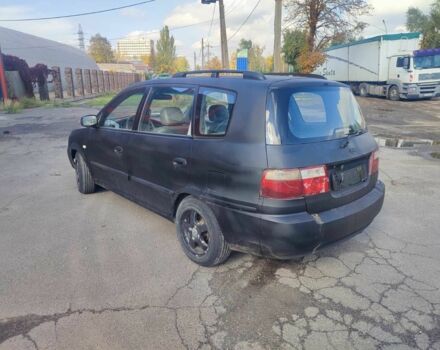 Серый Киа Каренс, объемом двигателя 2 л и пробегом 250 тыс. км за 1200 $, фото 3 на Automoto.ua