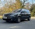 Серый Киа Каренс, объемом двигателя 2 л и пробегом 585 тыс. км за 3900 $, фото 1 на Automoto.ua