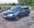 Серый Киа Каренс, объемом двигателя 1.6 л и пробегом 244 тыс. км за 4105 $, фото 1 на Automoto.ua