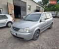 Сірий Кіа Каренс, об'ємом двигуна 1.99 л та пробігом 325 тис. км за 4100 $, фото 1 на Automoto.ua