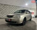 Серый Киа Каренс, объемом двигателя 2 л и пробегом 283 тыс. км за 3590 $, фото 1 на Automoto.ua