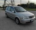 Серый Киа Каренс, объемом двигателя 2 л и пробегом 140 тыс. км за 4200 $, фото 1 на Automoto.ua